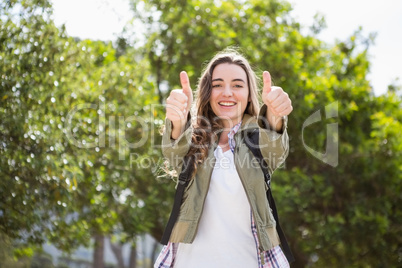 Smiling woman with thumbs up