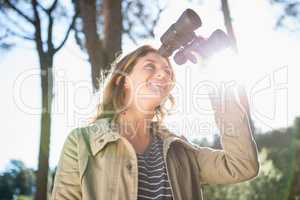 Woman using binoculars