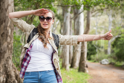 Portrait of woman hitch hiking