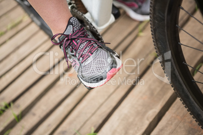 Close-up of woman cycling
