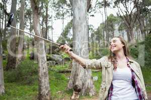 Smiling woman taking selfies