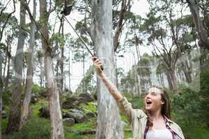 Smiling woman taking selfies