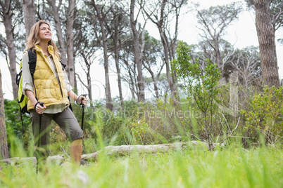 Smiling woman nordic walking