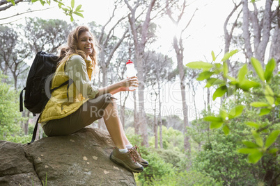 Woman sitting on a stone