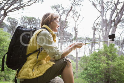 Smiling woman taking selfies