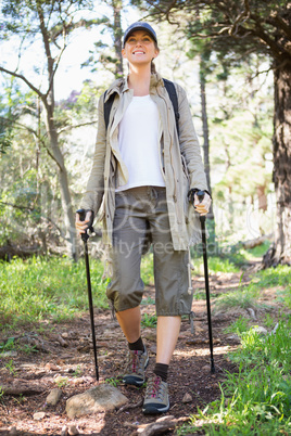 Smiling woman nordic walking