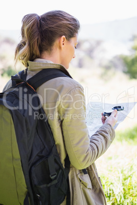 Woman with map and compass