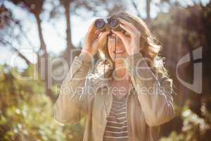 Woman using binoculars