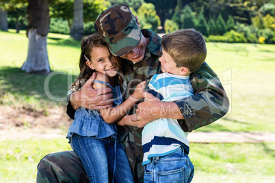 Happy soldier reunited with his son and daughter