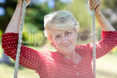 Close-up of a senior woman on swing