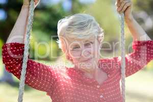 Close-up of a senior woman on swing