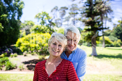 Senior couple embracing in park