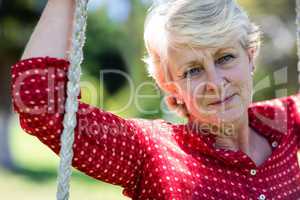 Close-up of a senior woman on swing