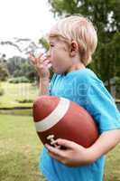 Boy using an asthma inhaler