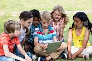 Children using digital tablet