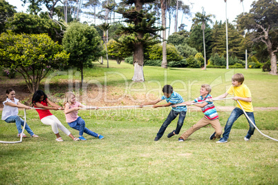 Children pulling a rope in tug of war