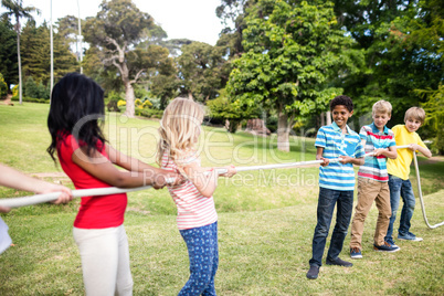 Children pulling a rope in tug of war