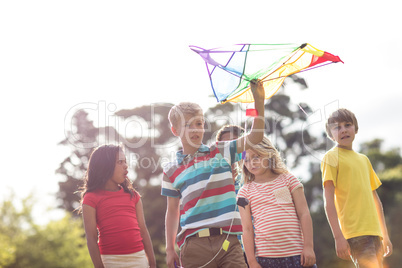 Happy children playing with a kite