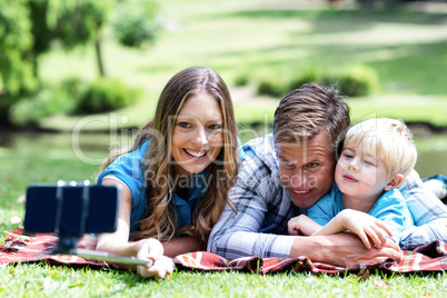 Parents and son taking a selfie on mobile phone