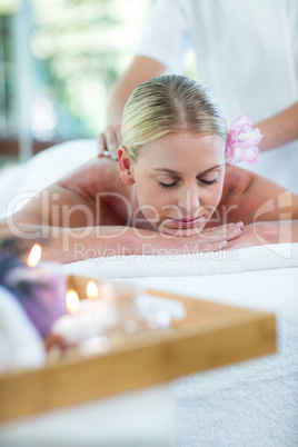 Woman receiving a back massage