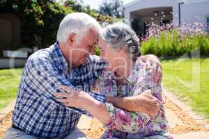 Senior couple embracing in the garden