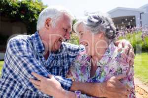 Senior couple embracing in the garden