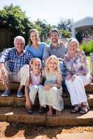 Multi-generation family sitting in the garden