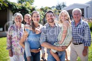 Portrait of a multi-generation family in the garden