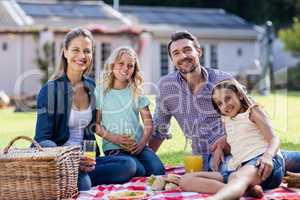 Portrait of happy family having a picnic