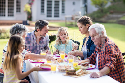 Happy family having lunch in the garden