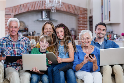 Multi-generation family using a laptop, tablet and phone