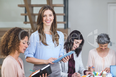 Portrait of businesswoman with digital tablet