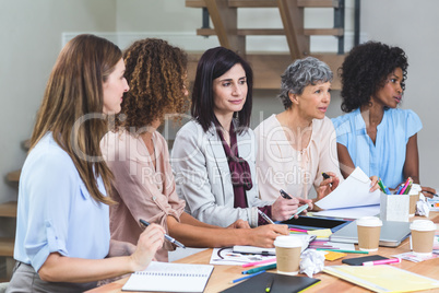 Group of interior designers listening to presentation