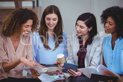 Female business colleagues interacting with each other