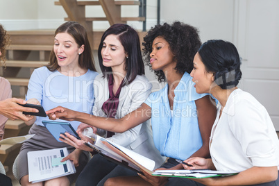 Female business colleagues interacting with each other