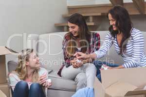 Friends interacting with each other in their new house