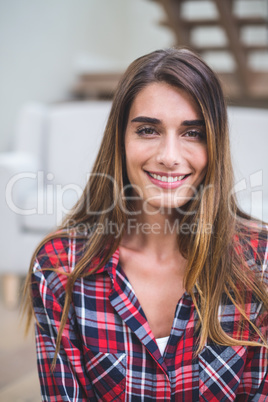 Beautiful woman smiling in living room