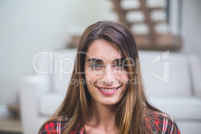 Beautiful woman smiling in living room