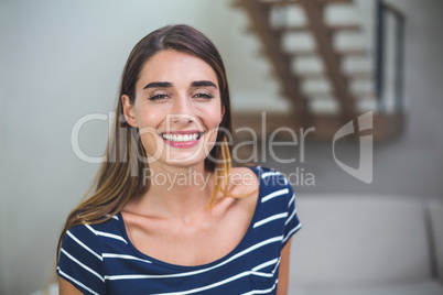 Beautiful woman smiling in living room