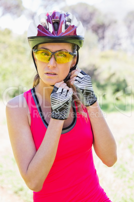 Woman opening her helmet Woman opening her helmet