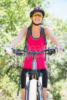 Smiling woman cycling