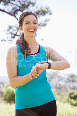 Smiling woman checking her watch