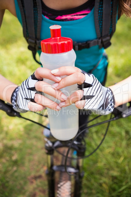 Woman standing next to her bike