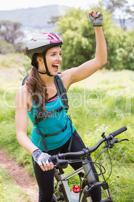 Smiling woman on her bike