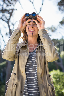 Woman using binoculars