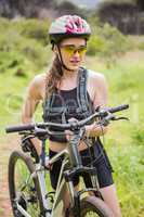 Woman carrying her bike