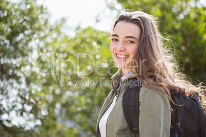 Smiling woman with backpack