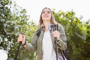 Smiling woman nordic walking