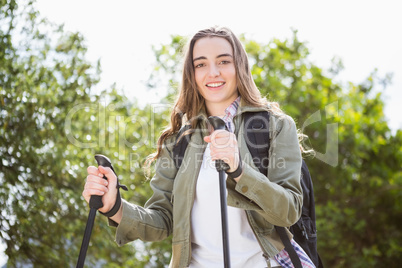 Smiling woman nordic walking