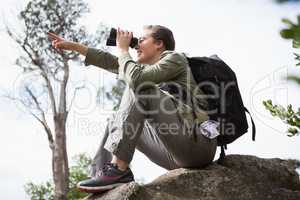 Woman using binoculars